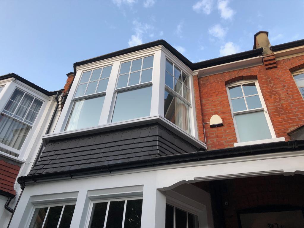 Modern secondary glazing fitted to a restored Victorian bay window