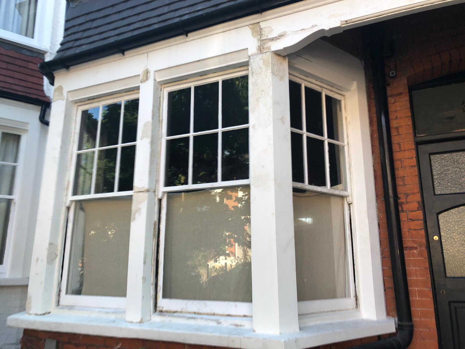 Traditional Georgian sash windows with restored glazing bars and original period details